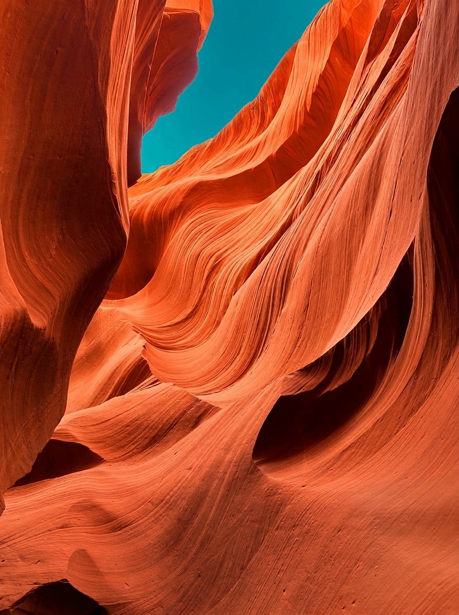 Sculpted slot canyon walls in warm orange sandstone for the inaugural issue of Resonance